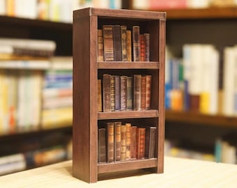 May include: A dark brown wooden bookshelf with three shelves, each filled with a variety of books with leather-bound covers. The books are arranged in a neat and organized manner.
