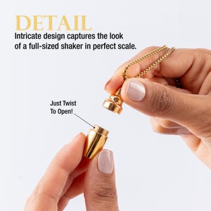 May include: A gold-colored pendant necklace with a small, detailed shaker design. The pendant unscrews to open. Text on the image reads "DETAIL" and "Just Twist To Open!"