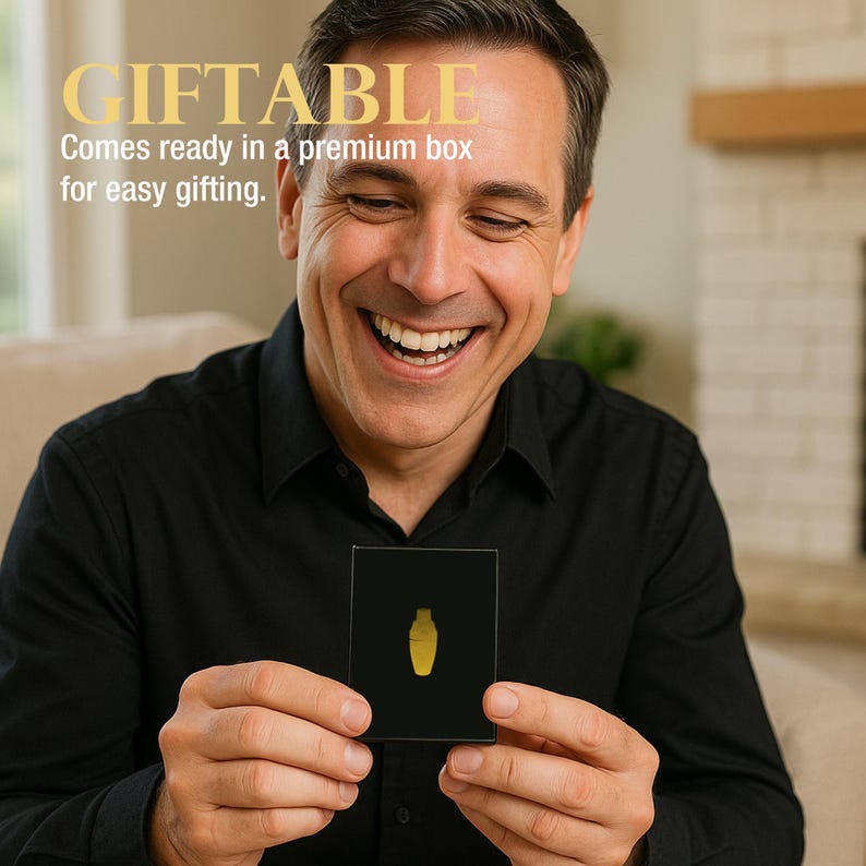 May include: A man holding a black box with a gold-colored design. The box has the word "GIFTABLE" in gold letters, with the text "Comes ready in a premium box for easy gifting."