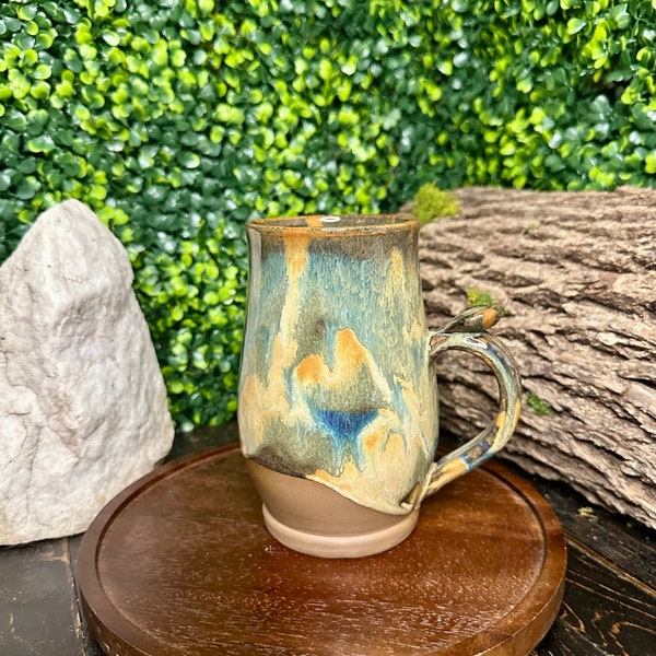 Artisan-crafted handmade pottery mug created using the wheel throwing technique.