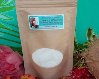 May include: A brown paper pouch with a white label that reads "From Hawaii with Love Coconut Milk Powder" and lists uses for the powder. The pouch is filled with white powder and is sitting on a woven surface with red and pink flowers.