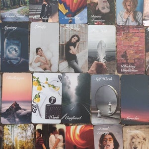May include: A selection of tarot cards featuring diverse imagery and text. Cards include "CrossRoad", "Ascending", "Mystery", "Lonely", "Challenges", "Work", "Self Worth", "Miracles", "Fall", "Third Party", "Twin Flames", "Sexual Energy", and "Courage". The cards have a vintage aesthetic.