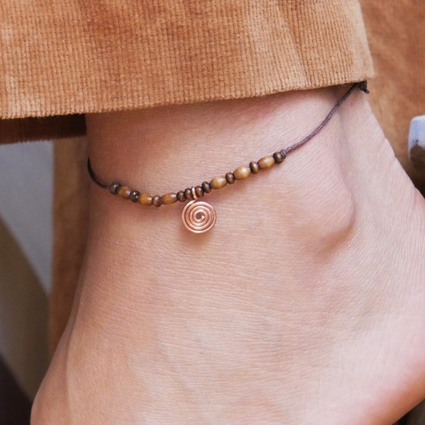 Delicate anklet with spiral and brown wooden beads