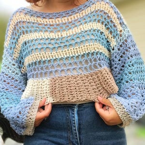 Pull en résille avec ourlet à volants