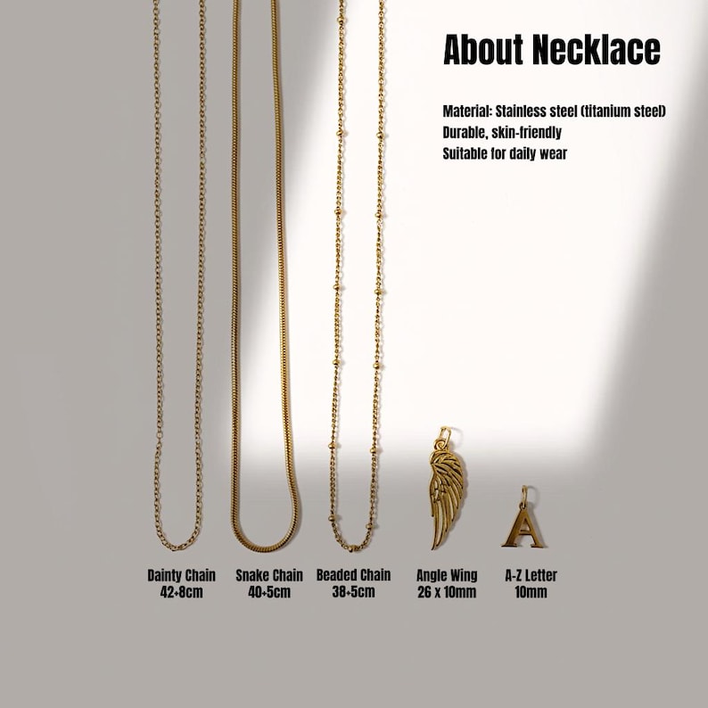 May include: A selection of gold-coloured necklaces, including a dainty chain, snake chain, and beaded chain. The image also features an angle wing pendant and an A-Z letter pendant. The necklaces are made of stainless steel.