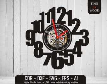 May include: A black and white clock with Roman numerals for the hours. The clock face is surrounded by a circle of black numbers 1 through 12. The clock is designed to be cut out of wood.