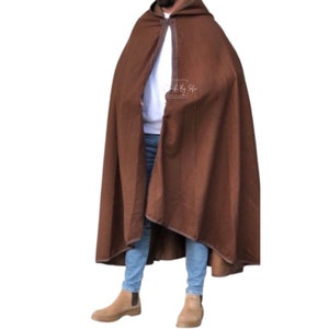 May include: A brown hooded cloak with a brown trim. The cloak is made of a soft, warm fabric and is perfect for keeping you warm in the cold weather.