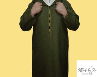 May include: A long-sleeved, hooded, green robe with a gold and black trim down the front. The robe is made of a soft, textured fabric.