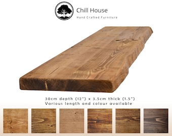 May include: A rustic wooden shelf with a live edge, measuring 12 inches deep and 1.5 inches thick. The shelf is made of reclaimed wood and has a natural finish. Various lengths and colors are available.