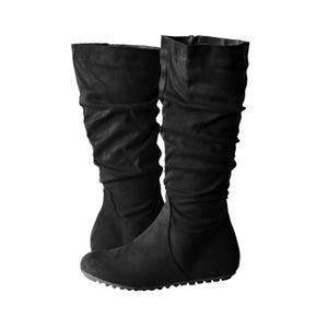 May include: A pair of black knee-high boots with a slouchy design. The boots have a flat sole and are made of a soft, suede-like material. The boots are a solid black color.