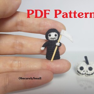May include: A miniature crochet Grim Reaper figure in black with a white scythe, and a small white pumpkin with a jack-o'-lantern face. The text "PDF Pattern" is in red at the top, and "ObscurelySmall" is at the bottom.