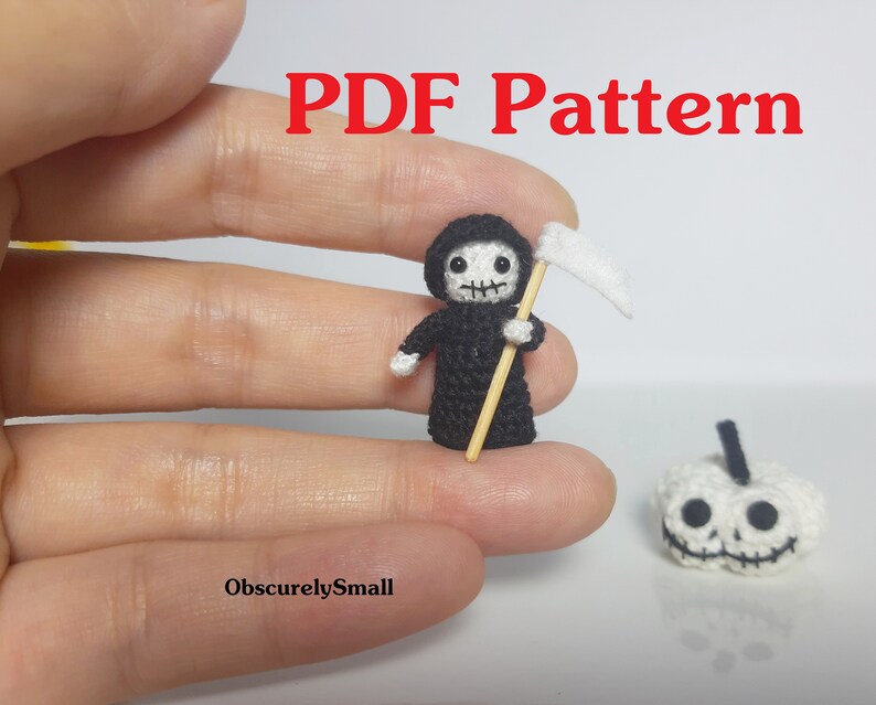 May include: A miniature crochet Grim Reaper figure in black with a white scythe, and a small white pumpkin with a jack-o'-lantern face. The text "PDF Pattern" is in red at the top, and "ObscurelySmall" is at the bottom.