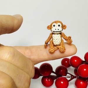 Malutki szydełkowy tyranozaur: miniaturowy smok amigurumi