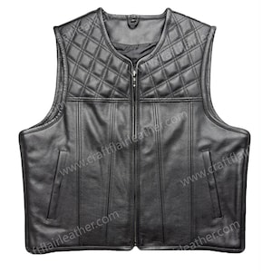 May include: A black leather vest featuring a quilted diamond pattern across the upper chest and shoulders. The garment has a central zipper closure, a round neckline, and two vertical slit pockets on the front. The text craftflairleather.com is visible.