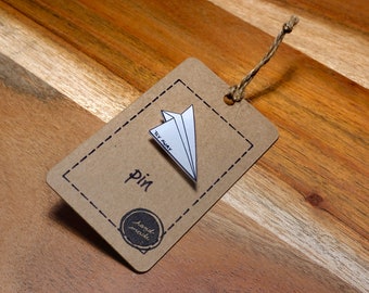 Paper airplane pin