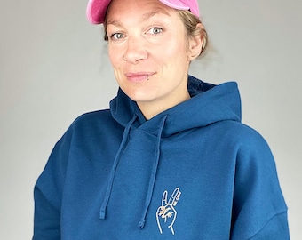 Fairtrade pullover in petrol blue with a feminist statement, ok ciao, organic cotton