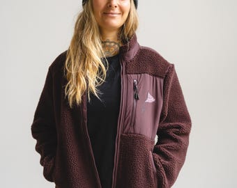 Fairtrade unisex teddy jacket with statement print “FCK NZS” or “Smash the Patriarchy” in burgundy and khaki