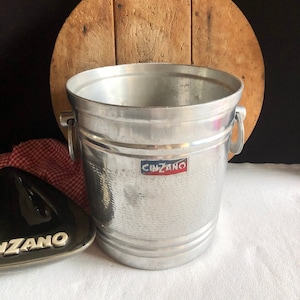 Vintage “CINZANO”  ice bucket, wine cooler, Champagne bucket. 1950’s. Iconic CINZANO logo on 2 sides. Unusual handles. Great vintage piece.