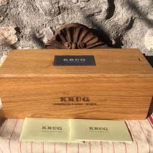 A KRUG  Clos de MESNIL 2002 CHAMPAGNE wooden box in excellent condition. Comes with original little booklet.
