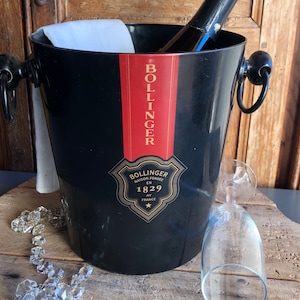 Vintage schwarzer „BOLLINGER“ Champagnerkühler, Eiskübel, Weinkühler. Die ABFAB Mädels und 007 LOOOOVED ein Spott für Bolly. Französisch, 1980er Jahre.