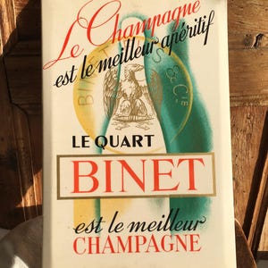 Cartel publicitario vintage de champán «LE BINET». Metal sobre cartón. Se puede colgar o colocar de pie.