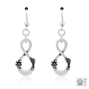 May include: Silver-toned earrings featuring an infinity symbol design. Each earring has a paw print and a footprint at the base of the infinity loop. The earrings have a hook closure.