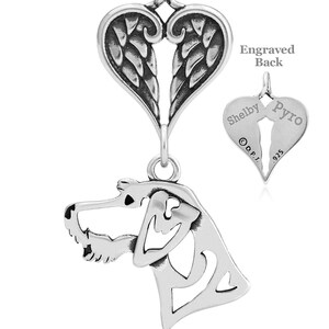 Könnte beinhalten: Sterling-Silber-Anhänger mit der Silhouette eines Hundekopfes mit Engelsflügeln und einem Herzen. Die Rückseite des Anhängers ist mit den Namen "Shelby" und "Pyro" sowie der Zahl "925" graviert.