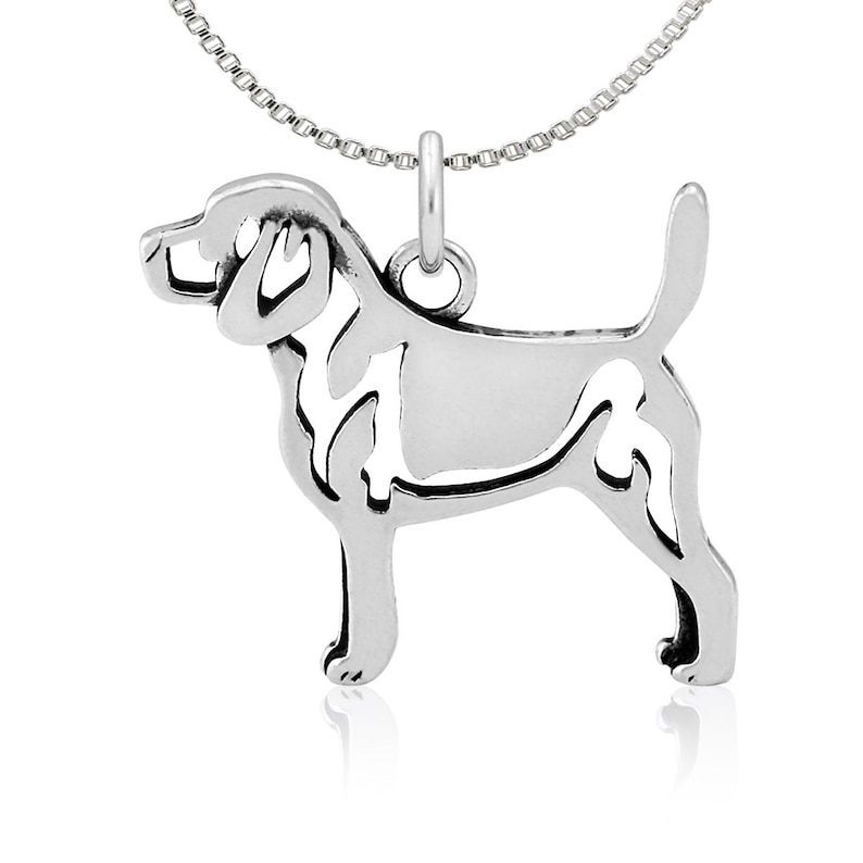 May include: Sterling silver necklace featuring a cutout design of a Beagle dog. The chain is a delicate silver box chain.