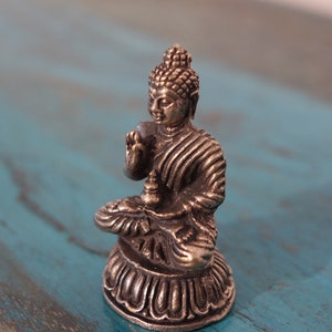 Old, very fine small Tibet. Silver Miniature Buddha Statue
