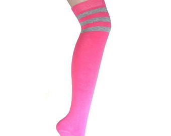 May include: Pink knee-high socks with three grey stripes around the top.