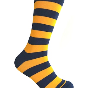May include: A pair of socks with alternating yellow and navy blue stripes. The socks are shown on a white background.
