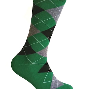 May include: Green, grey, and black argyle patterned socks. The socks have a white diamond pattern.
