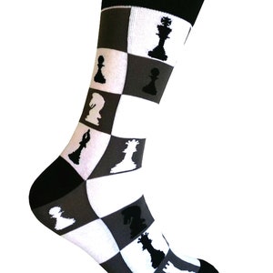 May include: A pair of white and gray socks with a chessboard pattern and black chess piece silhouettes.