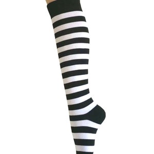 May include: Black and white striped knee-high socks.