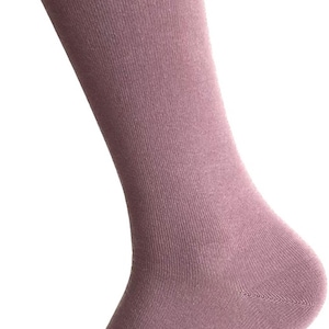 May include: A pair of solid mauve socks. The socks are made of a soft, comfortable material and have a ribbed texture.