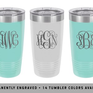 May include: Three stainless steel tumblers with personalized monograms. The tumblers are in turquoise, white, and turquoise. The monograms are engraved in a script font.