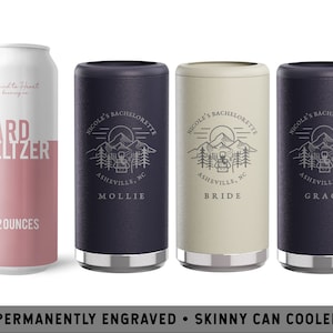 May include: Three personalized skinny can coolers with a mountain scene and the text "Nicole's Bachelorette" engraved on them. The coolers are in navy blue, beige, and gray. The text "Asheville, NC" is engraved below the mountain scene. The names "Mollie", "Bride", and "Grace" are engraved below the city and state.