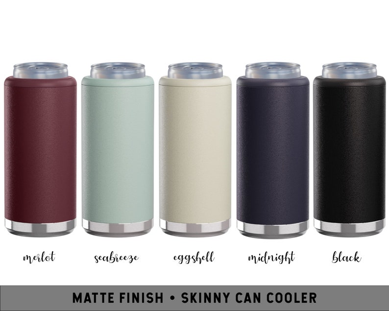 May include: Five skinny can coolers in different colors: merlot, seabreeze, eggshell, midnight, and black. The coolers are made of a matte finish material and have a silver band around the top and bottom.