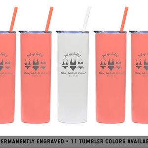 May include: Five coral and white stainless steel tumblers with black straws. Each tumbler has a white graphic of a swimsuit and the text "Suit up, ladies!" and "Olivia's Bachelorette Weekend Miami, FL".