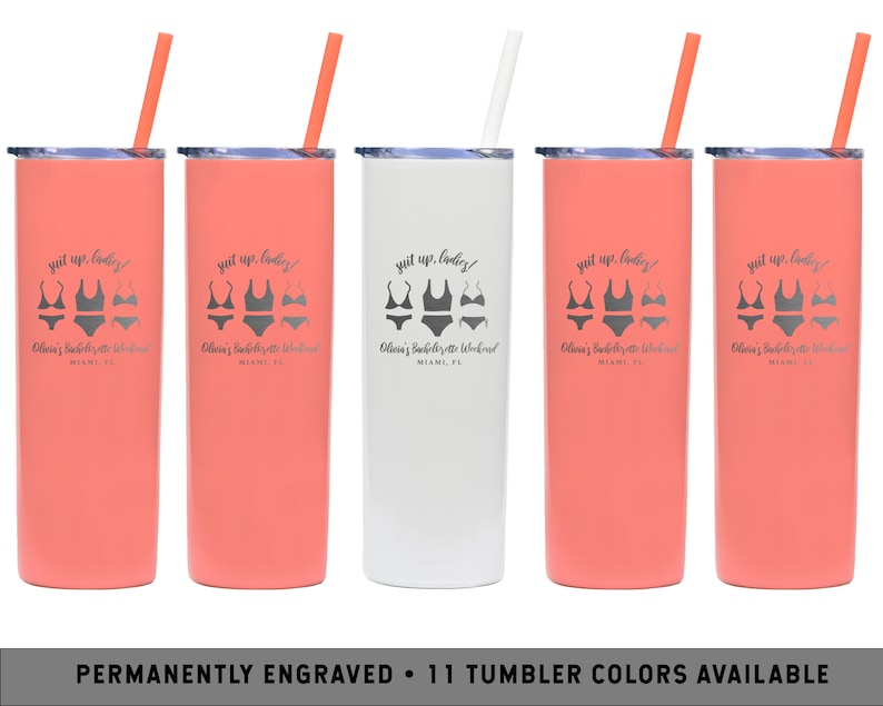 May include: Five coral and white stainless steel tumblers with black straws. Each tumbler has a white graphic of a swimsuit and the text "Suit up, ladies!" and "Olivia's Bachelorette Weekend Miami, FL".