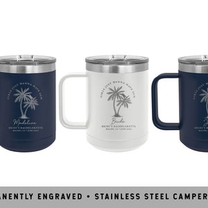 May include: Three stainless steel camper mugs with a palm tree design and the text "Girls just wanna have sun" engraved on the side. The mugs are in navy blue, white, and navy blue. The text on the mugs reads "Madeline", "Bride", and "Jamie".