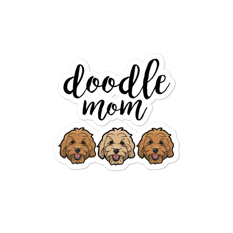 May include: Doodle Mom text with three cartoon doodle dogs. The dogs are brown, cream, and apricot.