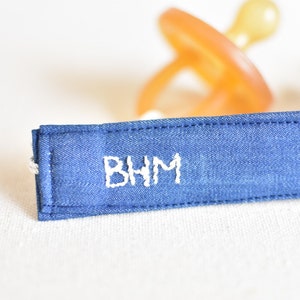 Blue denim jean hand embroidered pacifier clip holder monochrome solid baby child custom initial monogram personalized name