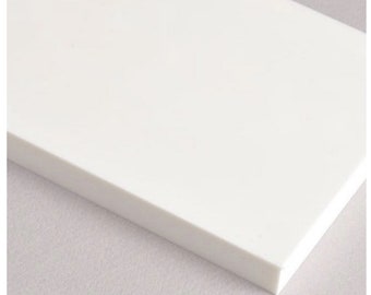May include: A white, rectangular sheet of acrylic plastic. The sheet is smooth and has a slight sheen.