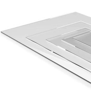 May include: A stack of clear, transparent acrylic sheets of varying sizes. The sheets are rectangular and arranged in a layered fashion, with the largest sheet at the bottom and smaller ones on top. The edges of the sheets are visible, creating a sense of depth.