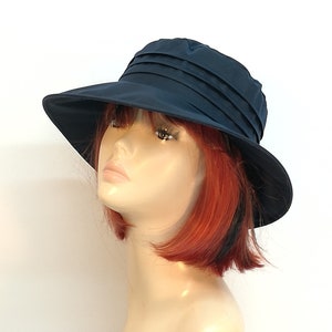 Navy wide brimmed Martha rain hat with pleated waterproof crown, womens wax cotton hat.