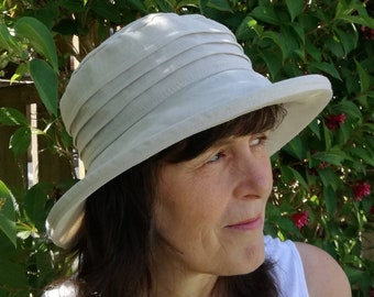 Classic stone linen sun hat for ladies with stiffened brim, packs and travels well.