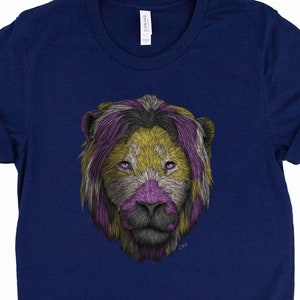 May include: A navy blue t-shirt featuring a graphic of a lion's face. The lion's mane is styled in the colours of the genderqueer pride flag: yellow, purple, and white.