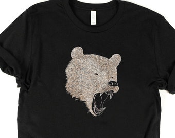 May include: Black t-shirt with a graphic of a roaring bear's head.