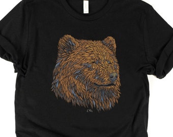 May include: Black t-shirt with a brown and blue bear illustration. The bear's head is facing right and has a detailed design.